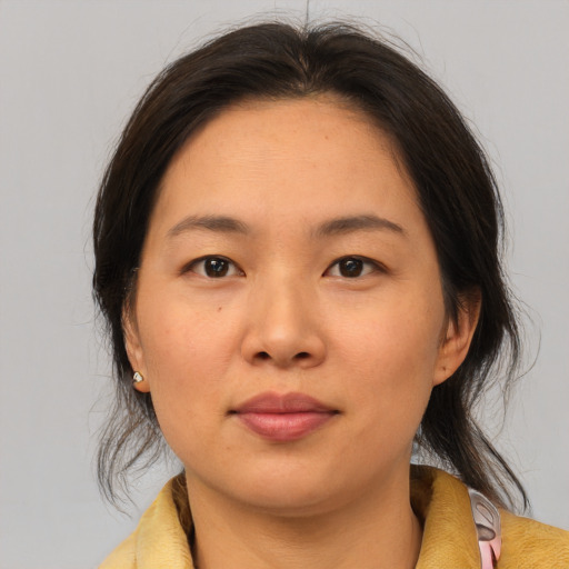 Neutral asian young-adult female with medium  brown hair and brown eyes
