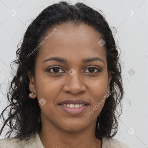 Joyful black young-adult female with long  brown hair and brown eyes