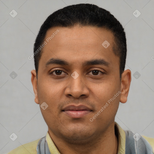 Joyful latino young-adult male with short  black hair and brown eyes