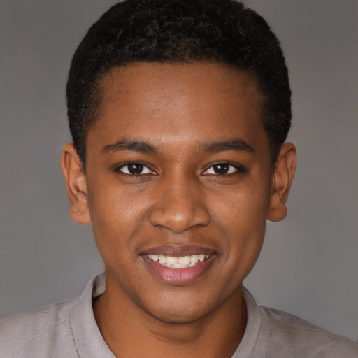 Joyful black young-adult male with short  brown hair and brown eyes