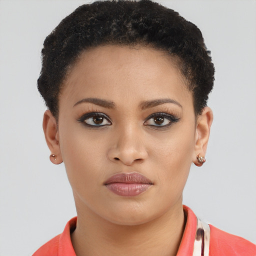Joyful black young-adult female with short  brown hair and brown eyes