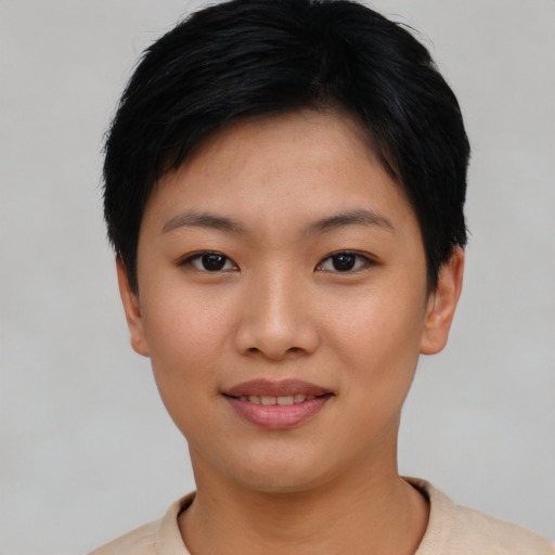 Joyful asian young-adult female with short  black hair and brown eyes