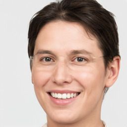 Joyful white adult female with medium  brown hair and grey eyes