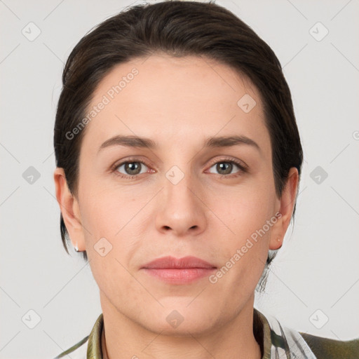 Joyful white young-adult female with short  brown hair and grey eyes