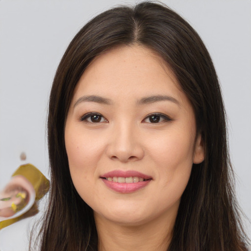 Joyful white young-adult female with long  brown hair and brown eyes