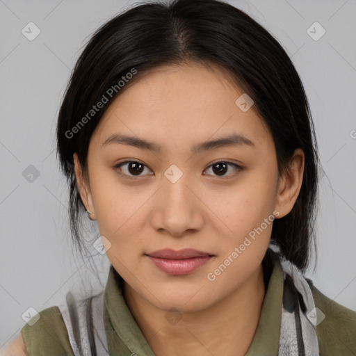 Joyful latino young-adult female with medium  brown hair and brown eyes