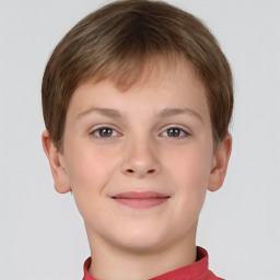 Joyful white child male with short  brown hair and brown eyes