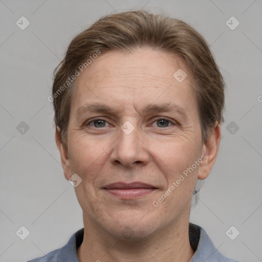 Joyful white adult male with short  brown hair and grey eyes