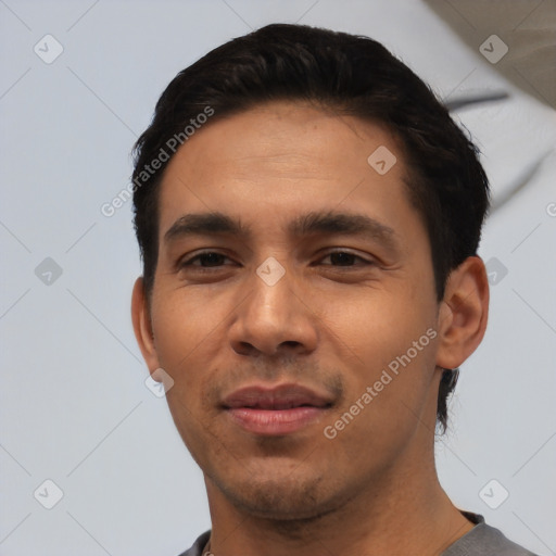 Joyful asian young-adult male with short  black hair and brown eyes