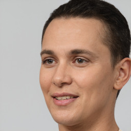 Joyful white adult male with short  brown hair and brown eyes