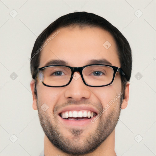 Joyful white young-adult male with short  black hair and brown eyes