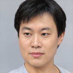 Neutral asian young-adult male with short  brown hair and brown eyes