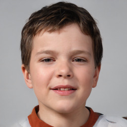 Joyful white child male with short  brown hair and brown eyes