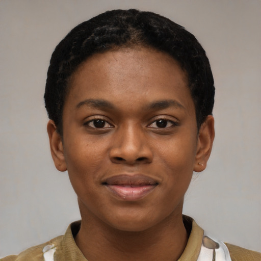 Joyful black young-adult female with short  black hair and brown eyes