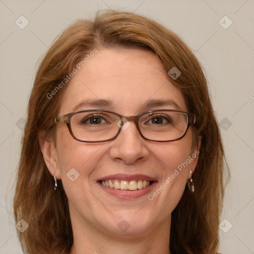 Joyful white adult female with medium  brown hair and blue eyes