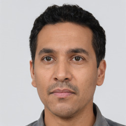 Neutral latino young-adult male with short black hair and brown eyes