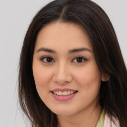 Joyful asian young-adult female with long  brown hair and brown eyes