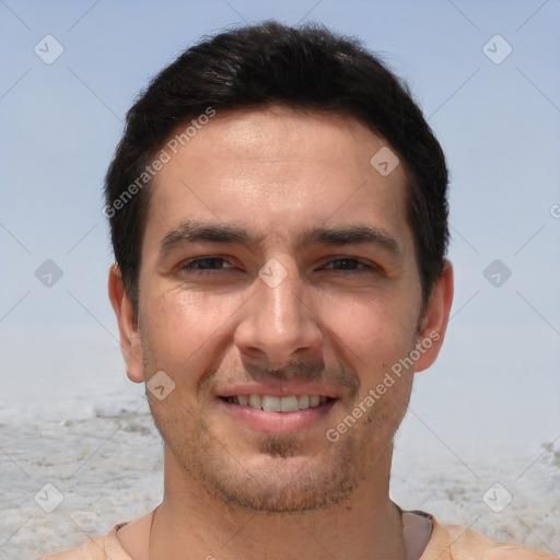 Joyful white young-adult male with short  brown hair and brown eyes