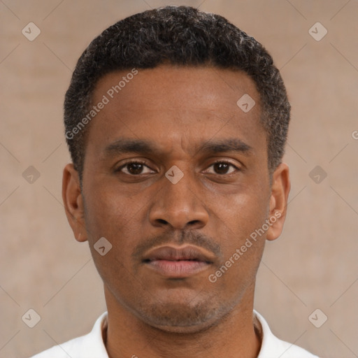 Neutral latino young-adult male with short  brown hair and brown eyes
