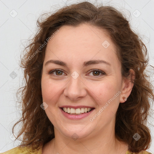 Joyful white adult female with long  brown hair and brown eyes