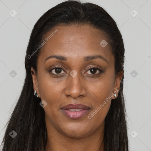 Joyful black young-adult female with long  brown hair and brown eyes