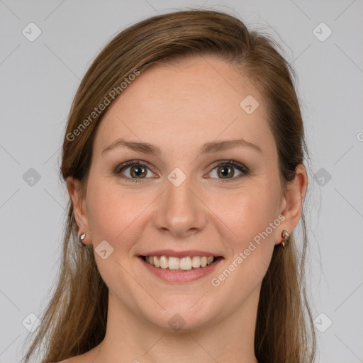 Joyful white young-adult female with long  brown hair and grey eyes