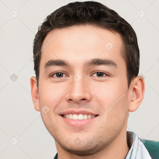 Joyful white young-adult male with short  brown hair and brown eyes