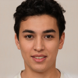 Joyful latino young-adult male with short  brown hair and brown eyes