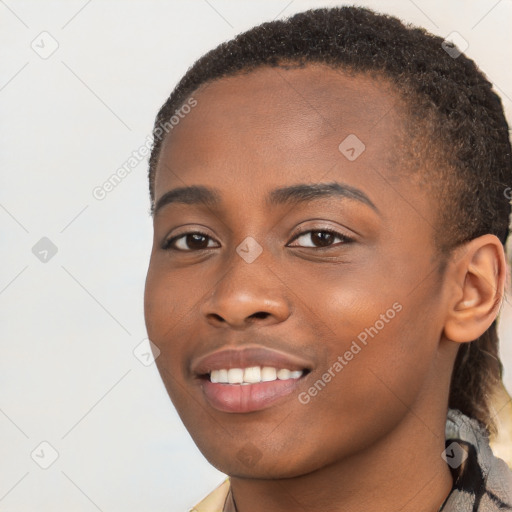 Joyful black young-adult female with long  brown hair and brown eyes