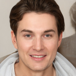 Joyful white young-adult male with short  brown hair and brown eyes