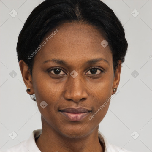 Joyful black young-adult female with short  black hair and brown eyes