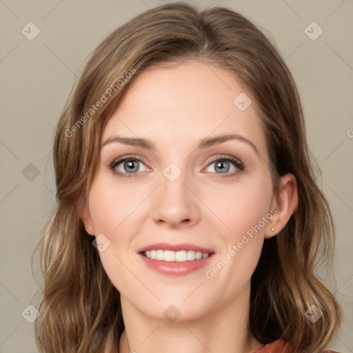 Joyful white young-adult female with medium  brown hair and green eyes