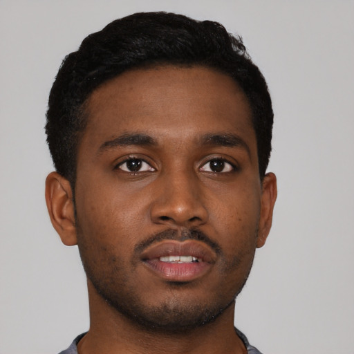 Neutral black young-adult male with short  black hair and brown eyes