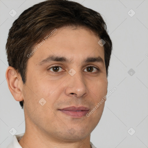 Joyful white young-adult male with short  brown hair and brown eyes