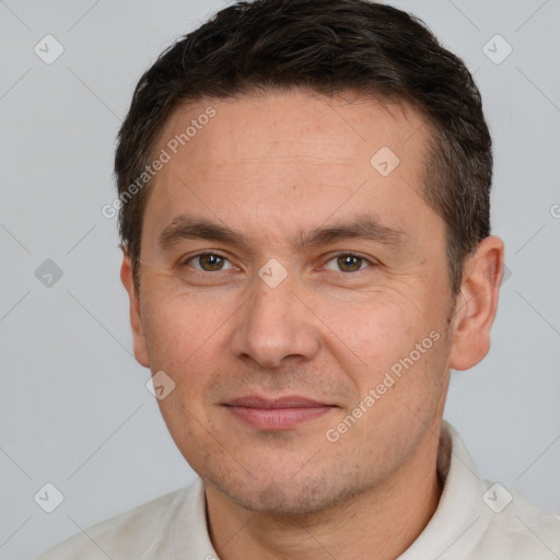 Joyful white adult male with short  brown hair and brown eyes