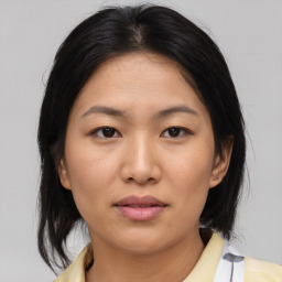 Neutral asian young-adult female with medium  brown hair and brown eyes