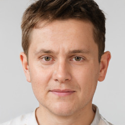 Joyful white adult male with short  brown hair and brown eyes