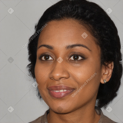 Joyful black young-adult female with medium  black hair and brown eyes