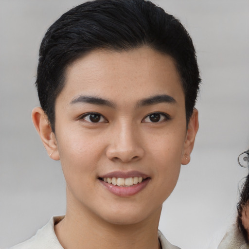 Joyful white young-adult female with short  black hair and brown eyes