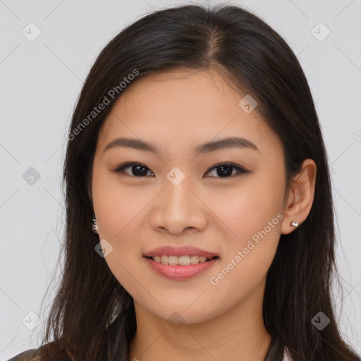 Joyful asian young-adult female with long  brown hair and brown eyes