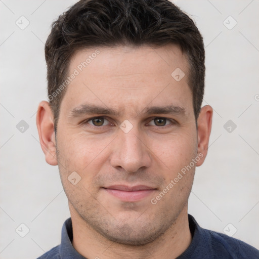 Joyful white adult male with short  brown hair and brown eyes