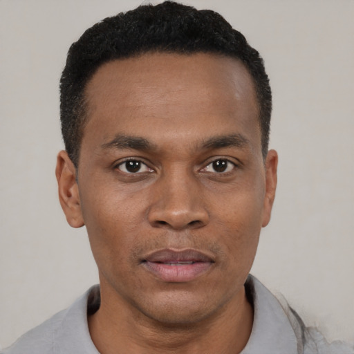 Neutral black young-adult male with short  black hair and brown eyes