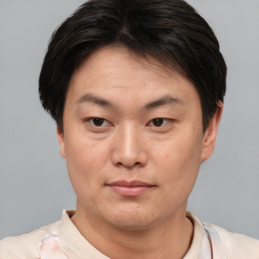 Neutral asian young-adult male with short  brown hair and brown eyes