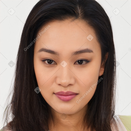 Joyful asian young-adult female with long  brown hair and brown eyes