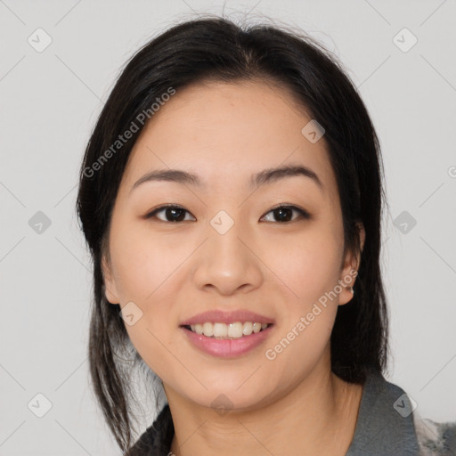 Joyful asian young-adult female with medium  black hair and brown eyes