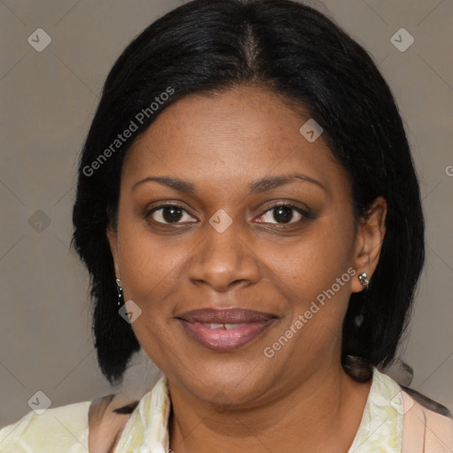 Joyful black adult female with medium  brown hair and brown eyes