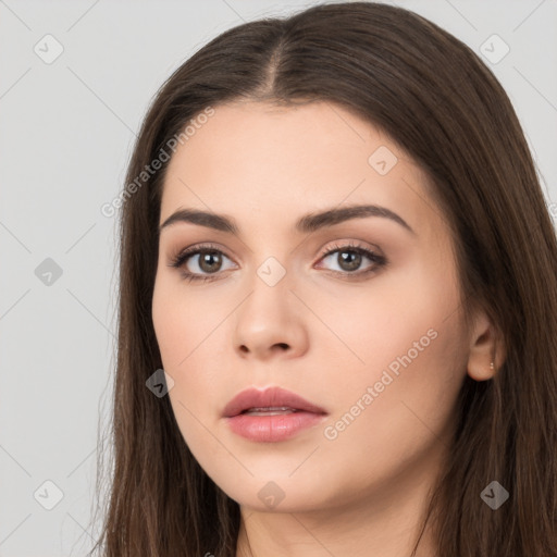 Neutral white young-adult female with long  brown hair and brown eyes