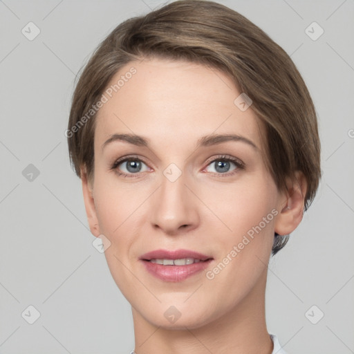 Joyful white young-adult female with short  brown hair and grey eyes