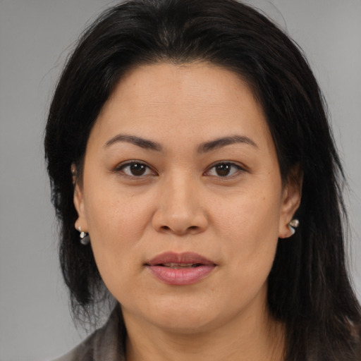 Joyful asian young-adult female with medium  brown hair and brown eyes