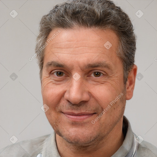 Joyful white middle-aged male with short  brown hair and brown eyes